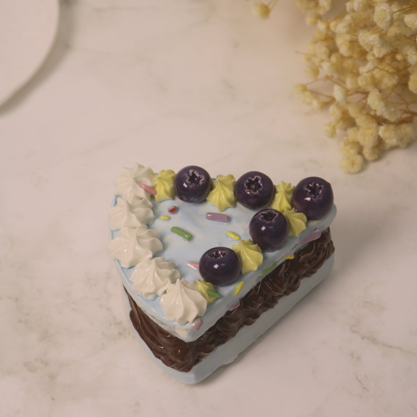 Handcrafted Artistic High-Temperature Firing of Triangular-Sliced Blueberry Ceramic Cake